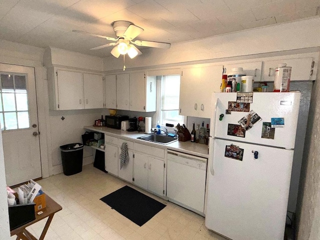 kitchen with a sink, light floors, ceiling fan, white appliances, and light countertops