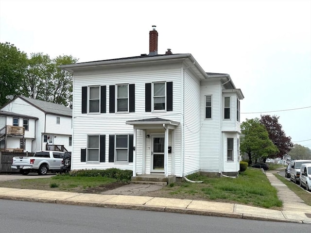 view of front of property with a chimney