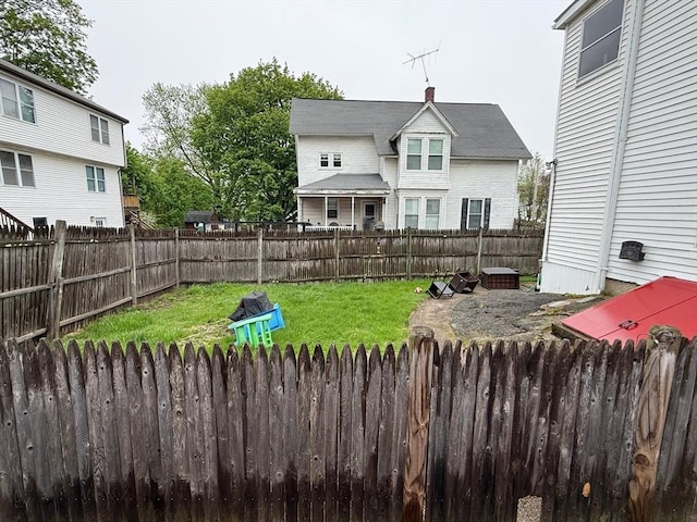 view of yard with a fenced backyard