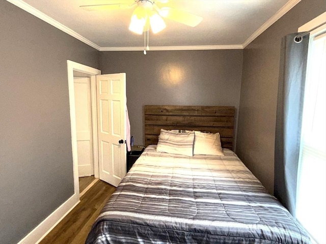 bedroom with dark wood-style flooring, ornamental molding, baseboards, and a ceiling fan