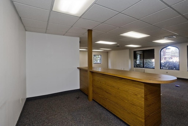 bar featuring a paneled ceiling, baseboards, visible vents, and carpet floors