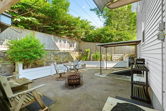 5 Eden Ct, Attleboro, MA 02703 - fenced backyard with a patio and an outdoor fire pit