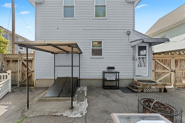 5 Eden Ct, Attleboro, MA 02703 - rear view of house with a fire pit, a gate, and a patio