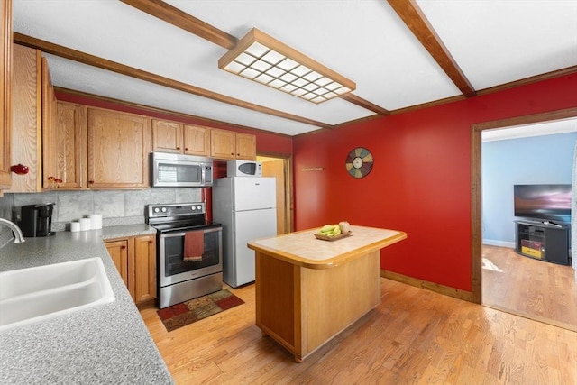 5 Eden Ct, Attleboro, MA 02703 - kitchen with appliances with stainless steel finishes, light countertops, a center island, and light wood-type flooring