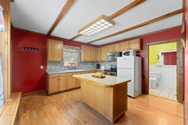 5 Eden Ct, Attleboro, MA 02703 - kitchen featuring appliances with stainless steel finishes, tile counters, a kitchen island, and light wood-style floors
