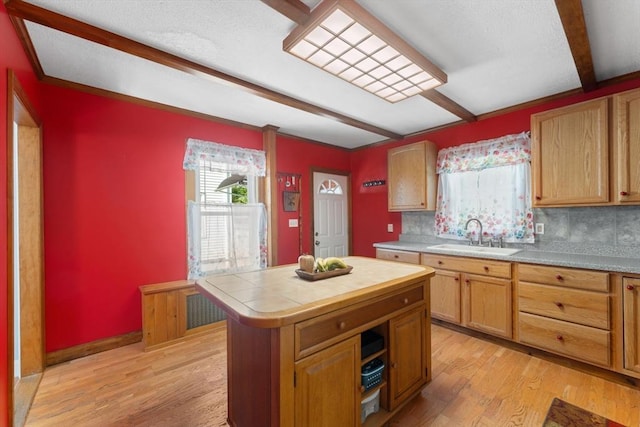 5 Eden Ct, Attleboro, MA 02703 - kitchen featuring light wood finished floors, decorative backsplash, beamed ceiling, a kitchen island, and tile counters