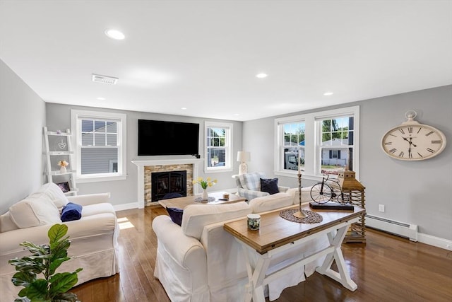 30 Millard Ave, Lynn, MA 01904 - living area with a baseboard radiator, wood finished floors, a glass covered fireplace, and recessed lighting