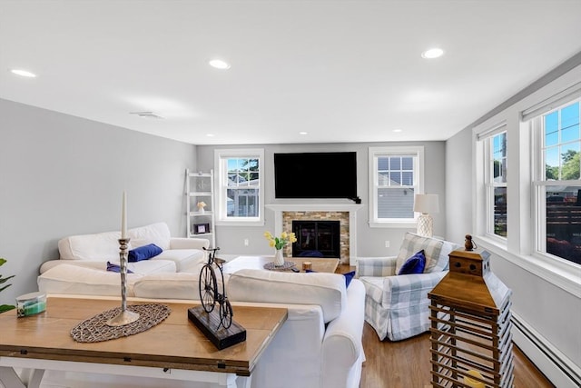 30 Millard Ave, Lynn, MA 01904 - living area featuring baseboard heating, a stone fireplace, and recessed lighting