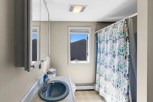 30 Millard Ave, Lynn, MA 01904 - bathroom with baseboard heating, vanity, and a shower with shower curtain