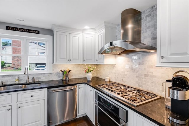 30 Millard Ave, Lynn, MA 01904 - kitchen with wall chimney exhaust hood, appliances with stainless steel finishes, white cabinets, decorative backsplash, and dark stone countertops