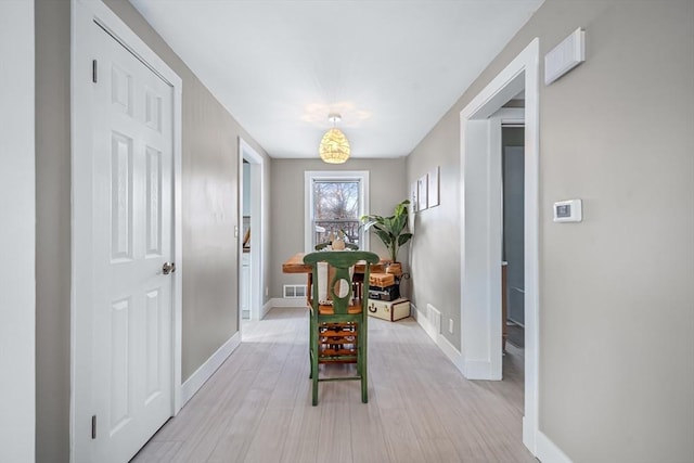 hallway with light wood-type flooring