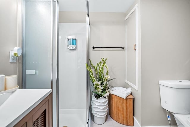 bathroom with vanity, toilet, and walk in shower