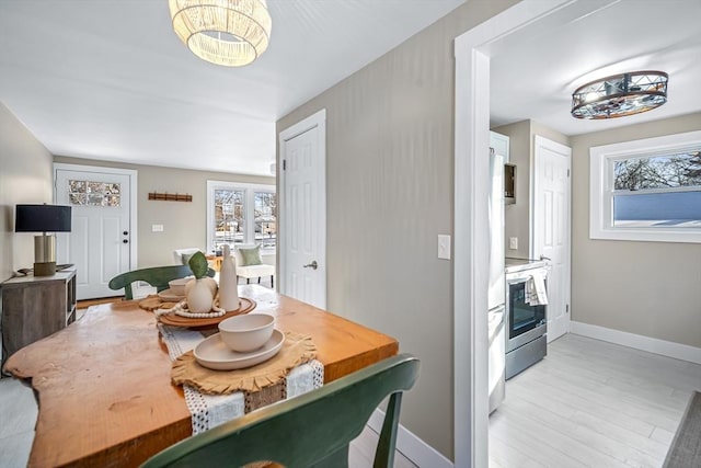 dining area with light hardwood / wood-style floors