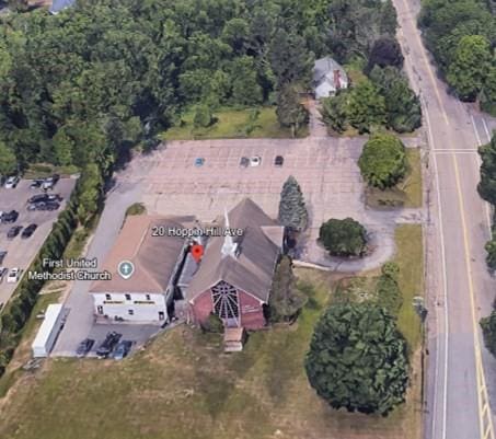 aerial view of property's location with a forest