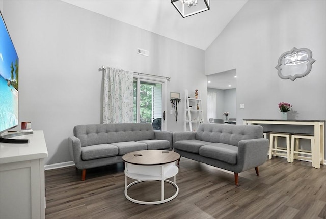 84 Tennis Plaza Rd Unit 46, Dracut, MA 01826 - living area featuring wood finished floors, high vaulted ceiling, baseboards, and a chandelier