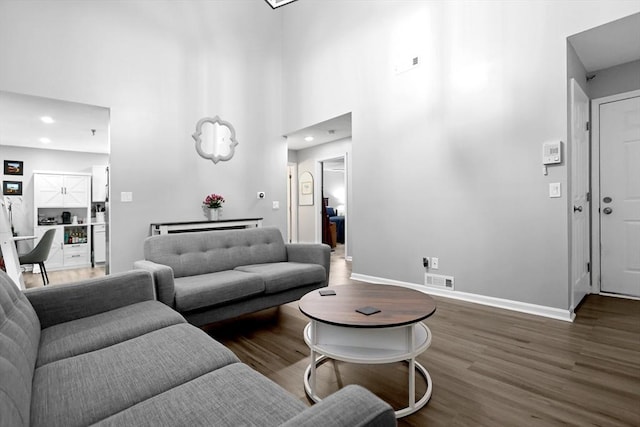 84 Tennis Plaza Rd Unit 46, Dracut, MA 01826 - living area featuring wood finished floors, recessed lighting, a towering ceiling, and baseboards
