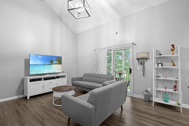 84 Tennis Plaza Rd Unit 46, Dracut, MA 01826 - living area featuring high vaulted ceiling, dark wood-type flooring, baseboards, and a chandelier