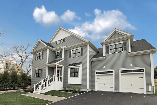 view of front of home featuring a garage and a front lawn