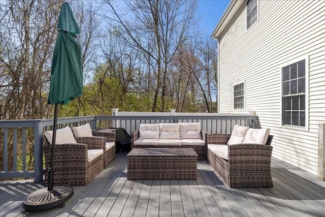 wooden deck featuring an outdoor living space