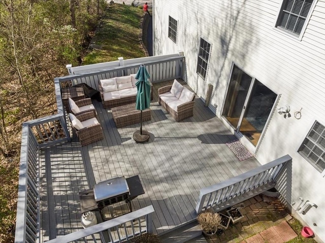 deck featuring outdoor lounge area