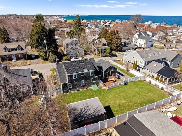 bird's eye view featuring a water view and a residential view