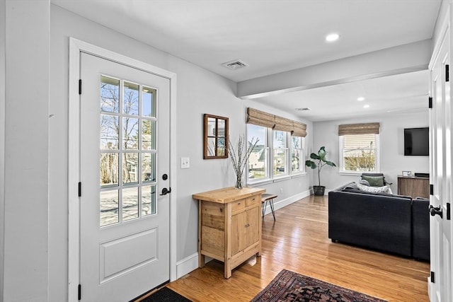 foyer entrance with baseboards, recessed lighting, light wood-style flooring, and visible vents