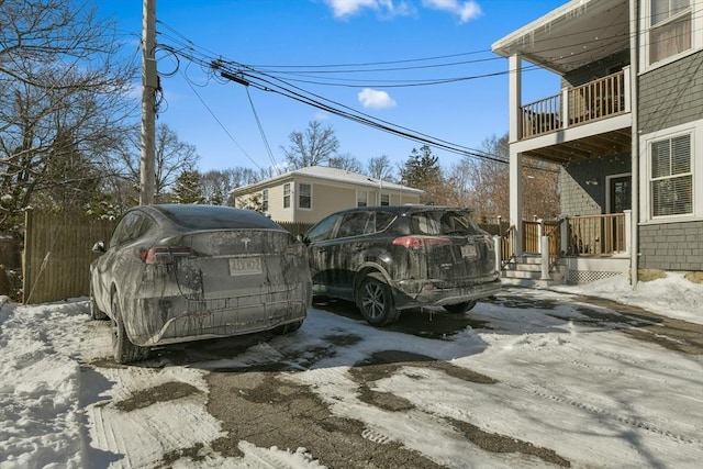 view of snow covered parking area