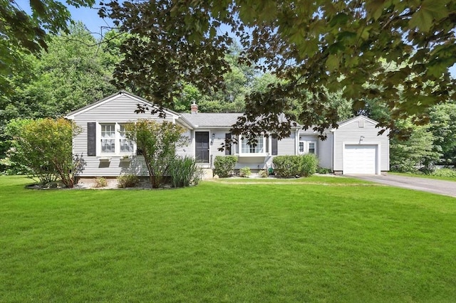 59 Searle Rd, South Hadley, MA 01075 - view of front of property featuring a garage, driveway, a front yard, and a chimney