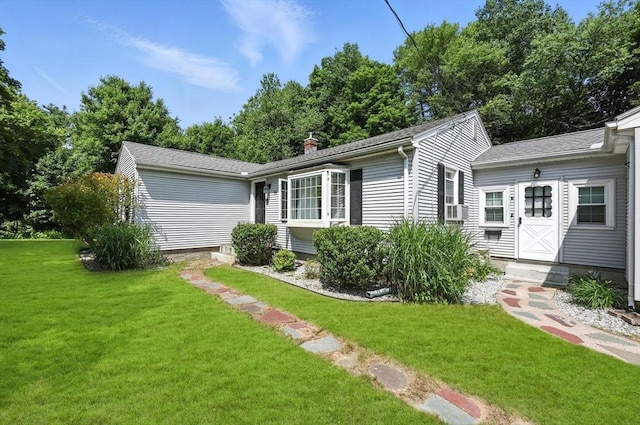 59 Searle Rd, South Hadley, MA 01075 - view of front of home with a front yard and a chimney