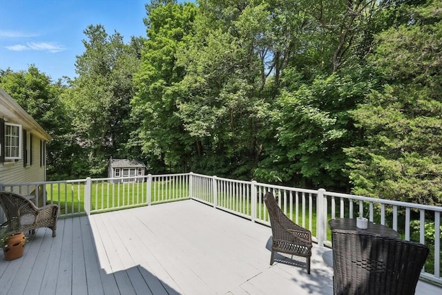 59 Searle Rd, South Hadley, MA 01075 - wooden terrace with a storage shed, a lawn, and view of wooded area
