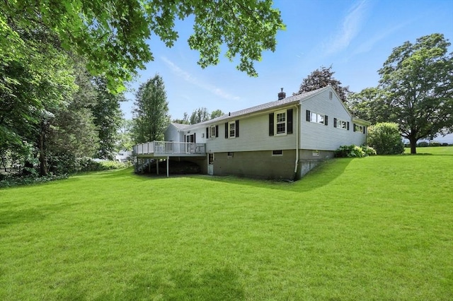 59 Searle Rd, South Hadley, MA 01075 - rear view of property featuring a deck, a yard, and a chimney