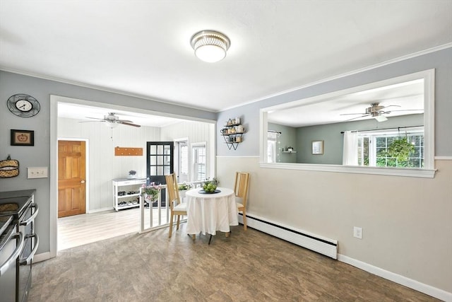 59 Searle Rd, South Hadley, MA 01075 - dining area with a baseboard radiator, a ceiling fan, wood finished floors, healthy amount of natural light, and ornamental molding