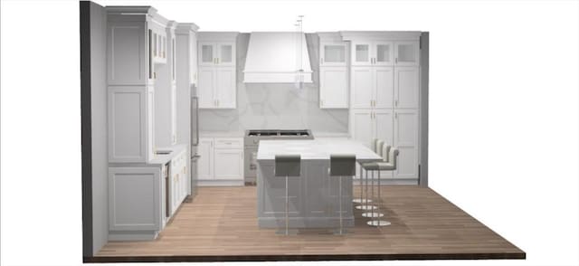 kitchen featuring a center island, pendant lighting, light countertops, glass insert cabinets, and wall chimney exhaust hood