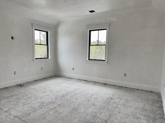 unfurnished room featuring baseboards