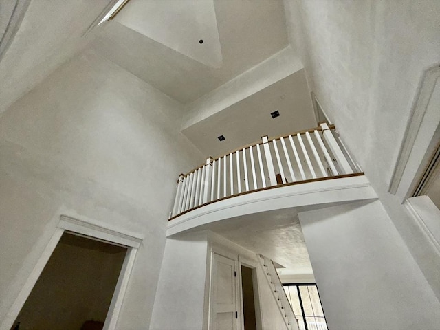 stairway with a towering ceiling