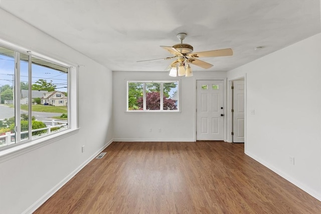 76 Choctaw Dr, Wareham, MA 02532 - unfurnished room with plenty of natural light, wood finished floors, baseboards, and a ceiling fan