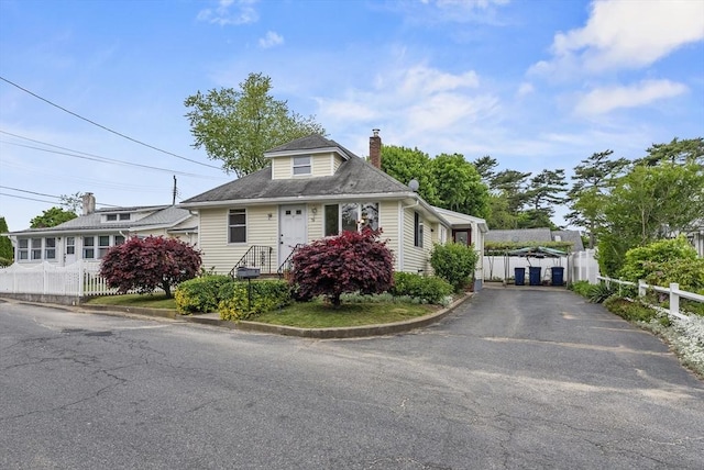 76 Choctaw Dr, Wareham, MA 02532 - bungalow-style home featuring asphalt driveway and a chimney