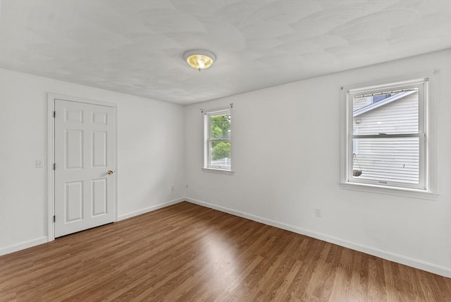 76 Choctaw Dr, Wareham, MA 02532 - unfurnished room with wood finished floors and baseboards