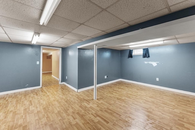 76 Choctaw Dr, Wareham, MA 02532 - below grade area with wood finished floors, a paneled ceiling, and baseboards