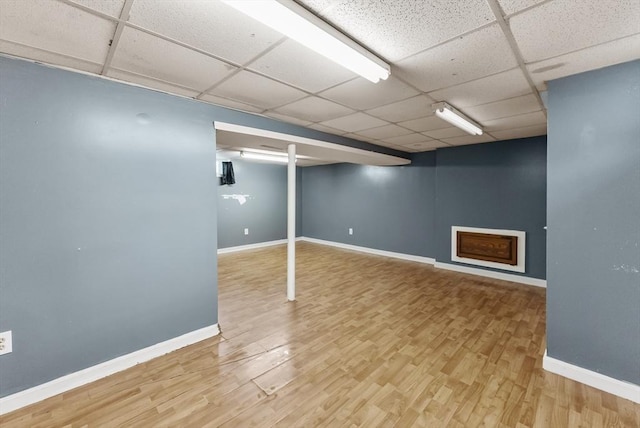 76 Choctaw Dr, Wareham, MA 02532 - finished basement featuring a paneled ceiling, wood finished floors, and baseboards