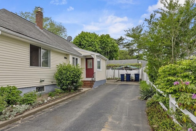 76 Choctaw Dr, Wareham, MA 02532 - view of front of property featuring driveway and a chimney