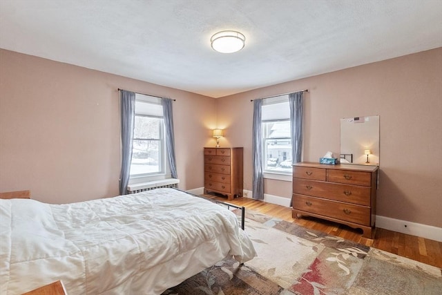 bedroom with light hardwood / wood-style flooring