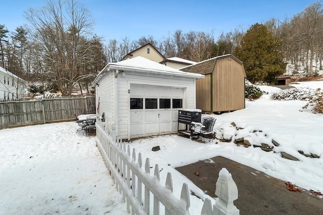 view of snow covered garage