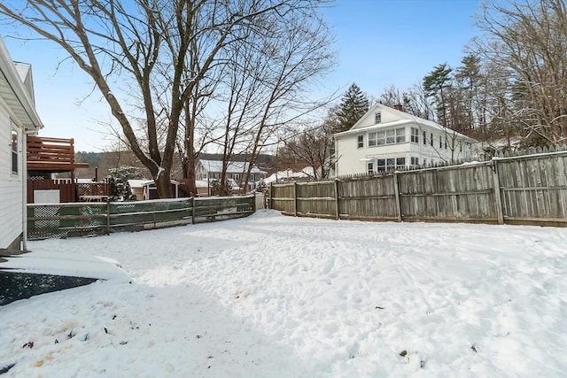 view of yard layered in snow