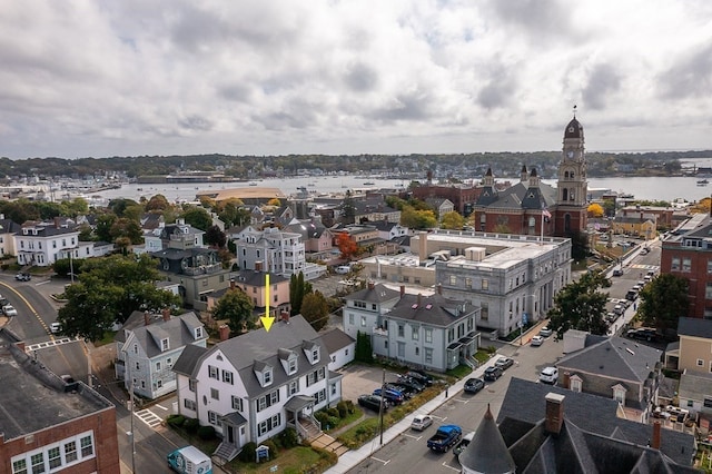 birds eye view of property featuring a water view