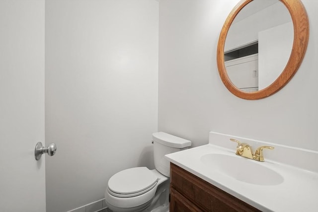 bathroom featuring toilet and vanity
