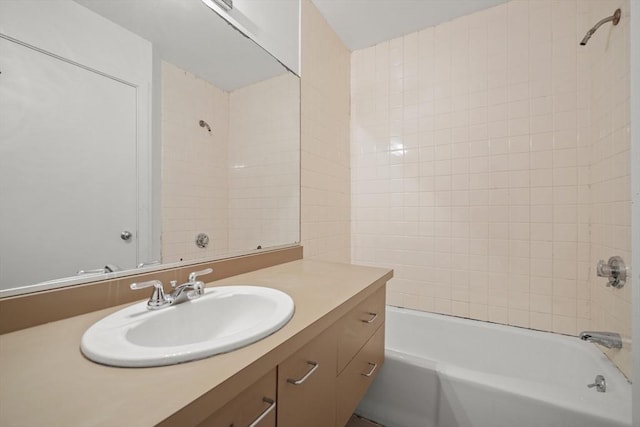 bathroom featuring bathtub / shower combination and vanity