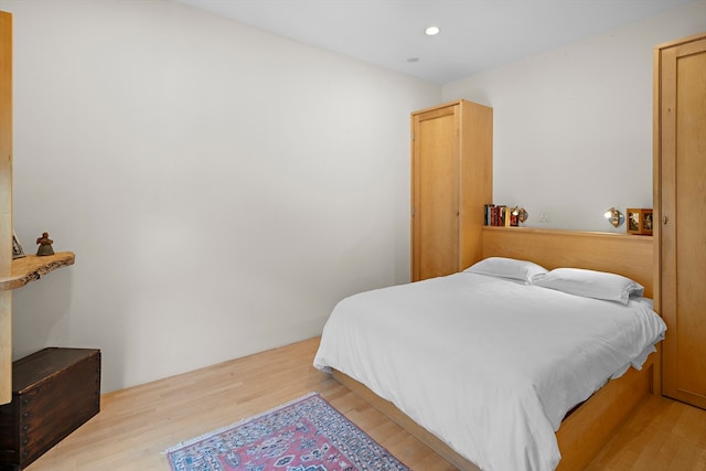 bedroom with light hardwood / wood-style floors