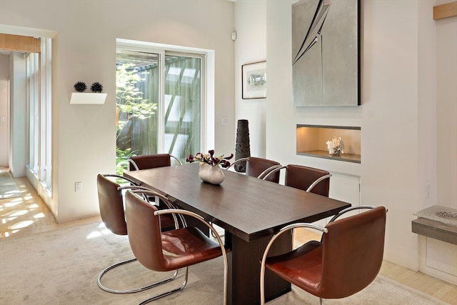 dining room featuring light colored carpet