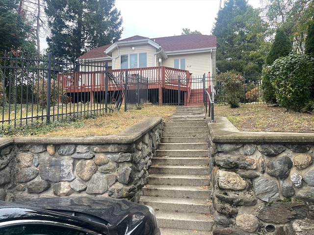 back of house featuring a deck